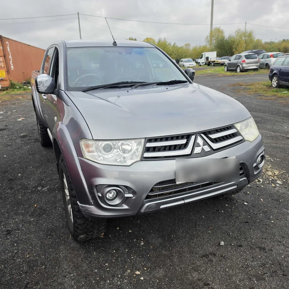 A grey Mitsubishi L200 pickup ready for delivery